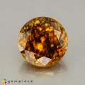 Natural Sphene 1.57 Carats Golden Brown with Red Flashes Round 7x7 mm Loose Gemstone - Image 1