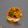 Natural Sphene 1.17 Carats Golden Yellow With Red Sparks Round 7x4 mm Loose Gemstone - Image 2