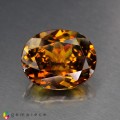 Natural Sphene 8.61 Carats Honey Yellow Brown with Red Flashes Oval 14x12 mm Loose Gemstone - Image 1