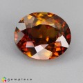 Natural Sphene 2.71 Carats Honey Yellow Brown with Red Flashes Oval 9x7 mm Loose Gemstone - Image 1