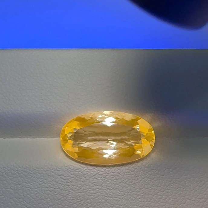 Natural Fluorescent Scapolite 5.29 Carats White to Fluorescent Orange Oval 17x10 mm Loose Gemstone - Image 1