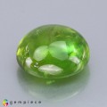 Natural Sphene 10.50 Carats Parrot Green Oval Cabochon 13x12 mm Loose Gemstone - Image 1